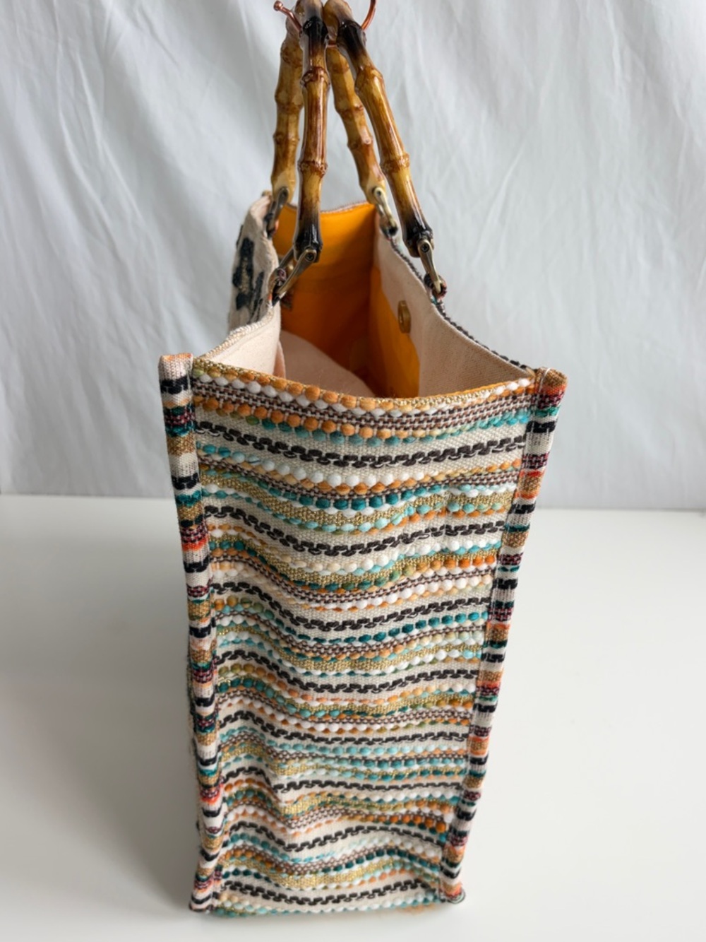 America & Beyond Luxe Leopard Tote Bag
Beaded Bamboo Handles Beige/Black/Orange - Picture 4 of 17